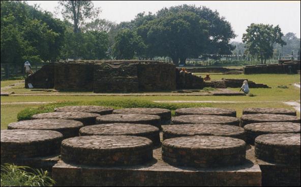photo of 16 votive stupa bases arranged in 4 by 4 rows located in Lumbini, birthplace of Buddha.